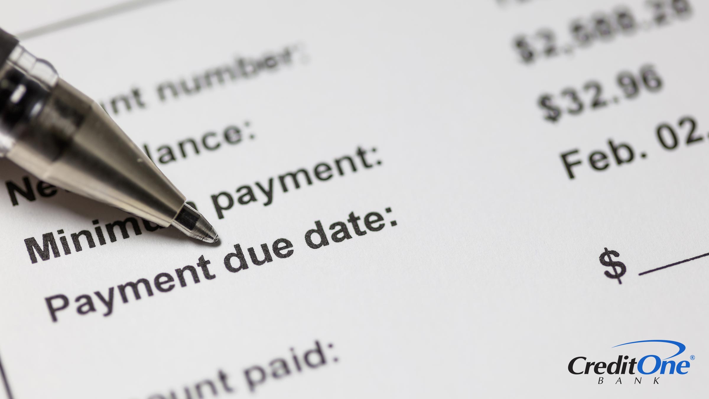A pen is poised at the payment due date on a close-up of a credit card statement. This is not the same as the statement closing date.