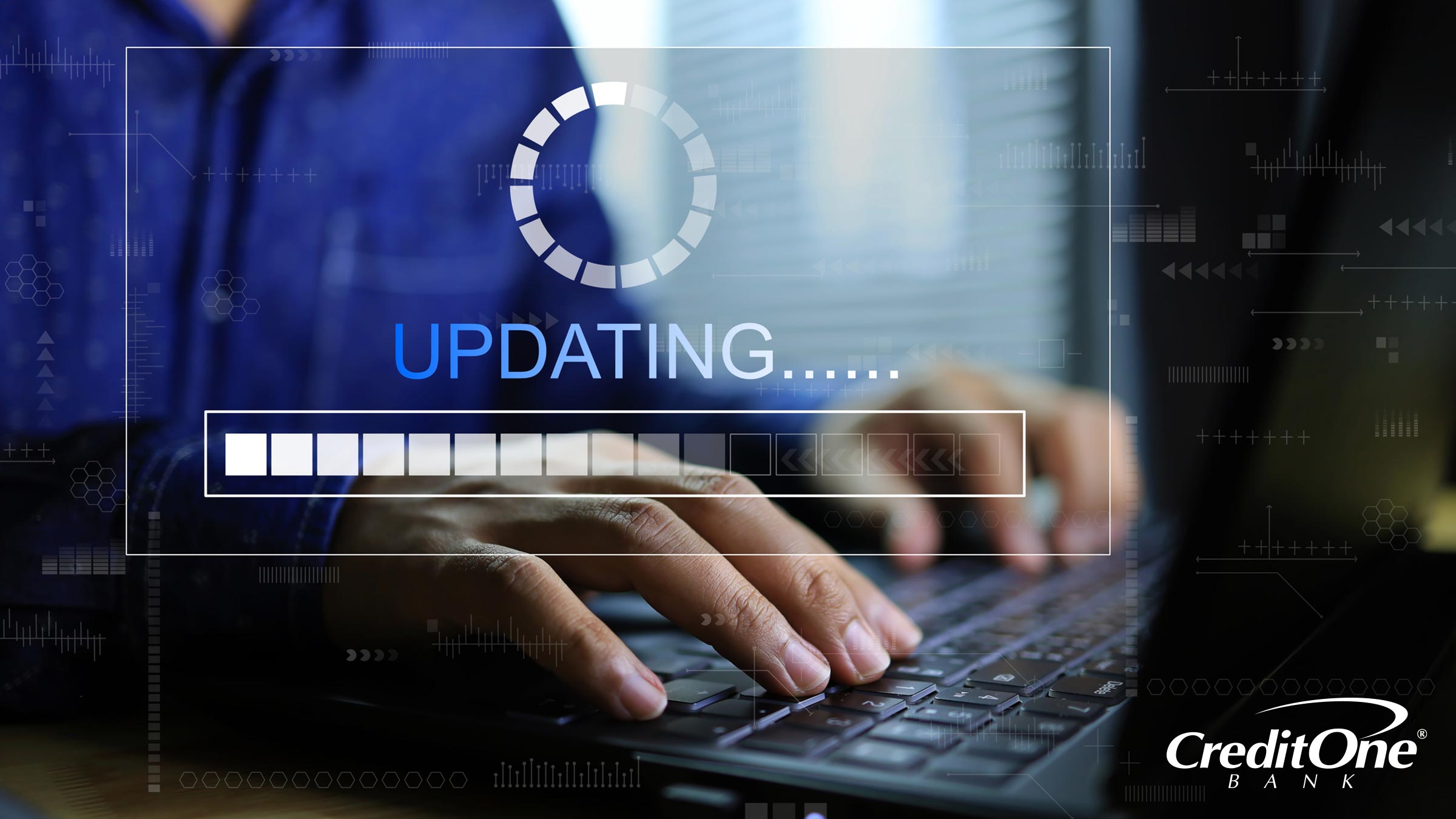 Two hands rest on a laptop’s keyboard behind an overlay of the word “Updating” and a progress bar. Perhaps this person is watching as their credit score updates on the screen.