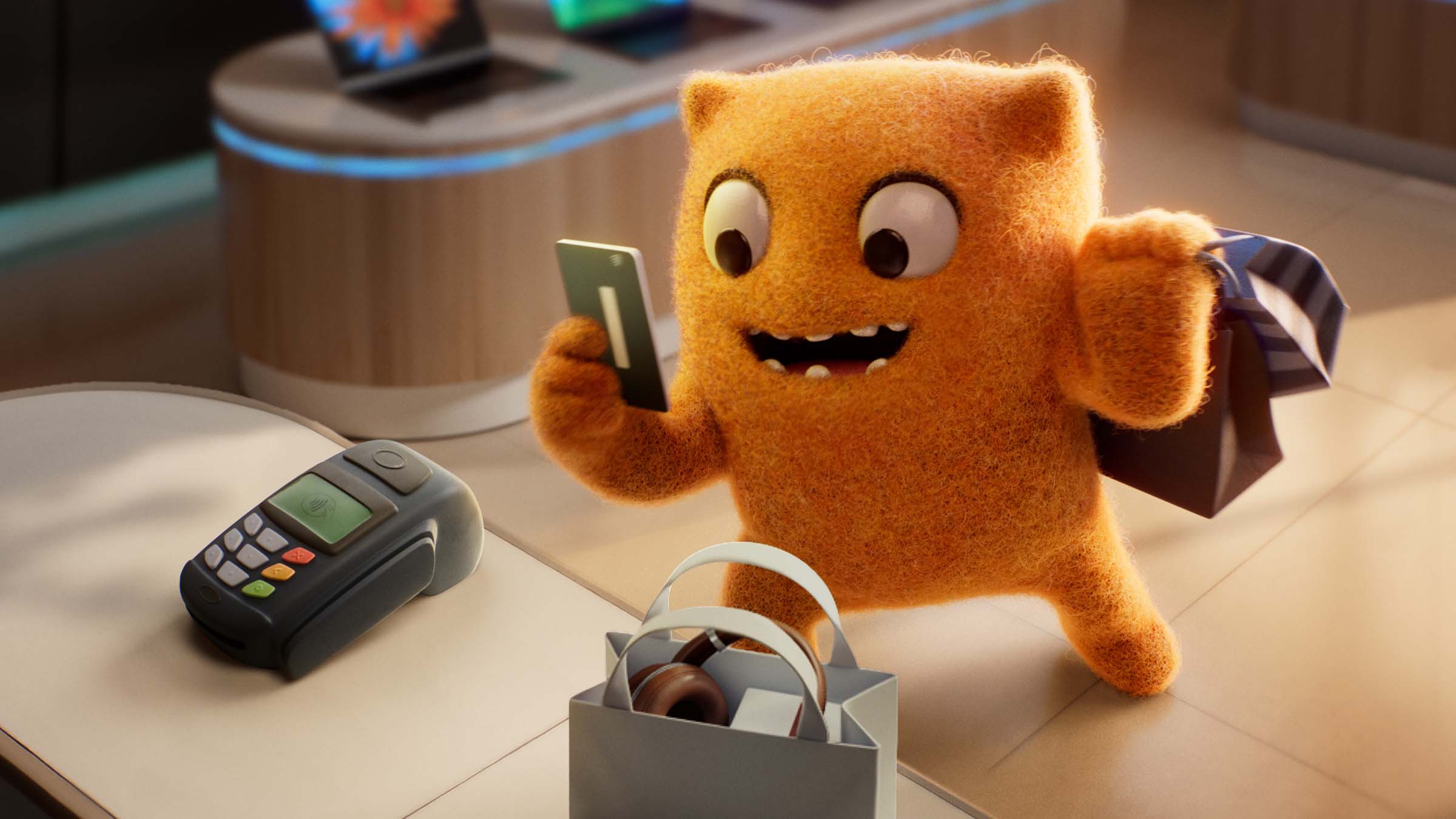 Max Out at the register holding a credit card to complete his shopping purchase