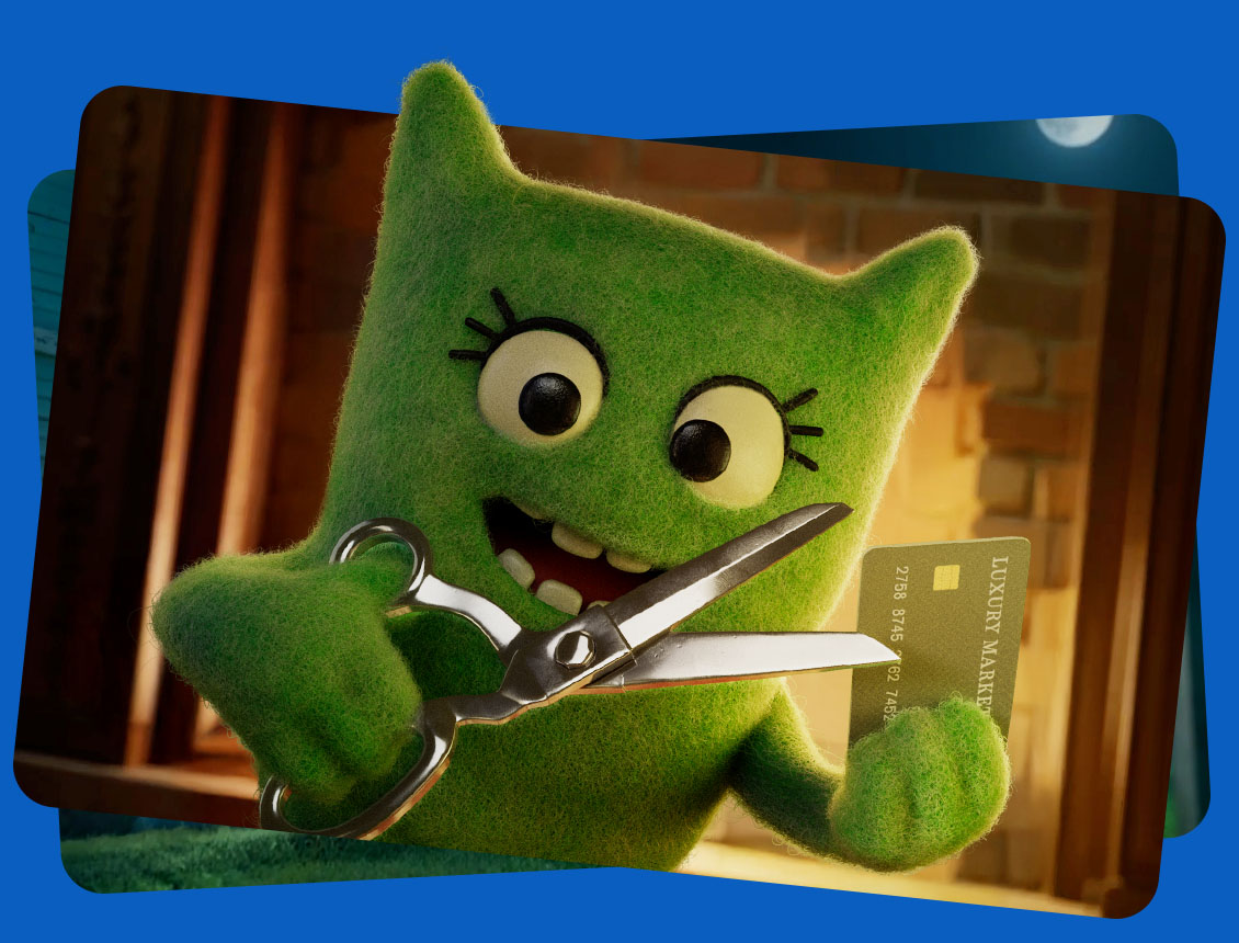 Cancelina cutting up a credit card