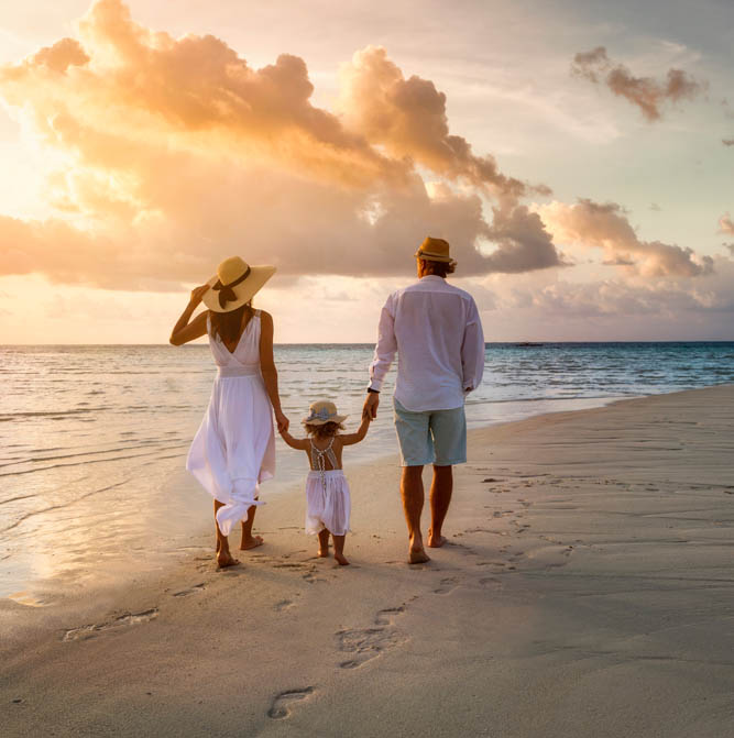 Man, woman, and child on the beach