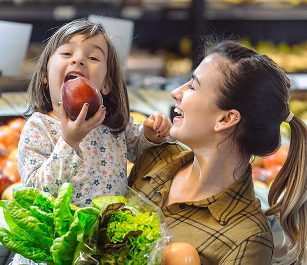 Mother and child grocery shopping