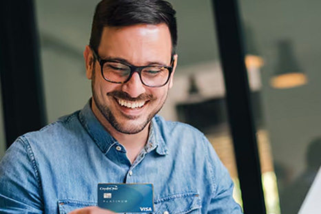 Man Holding a Credit One Card